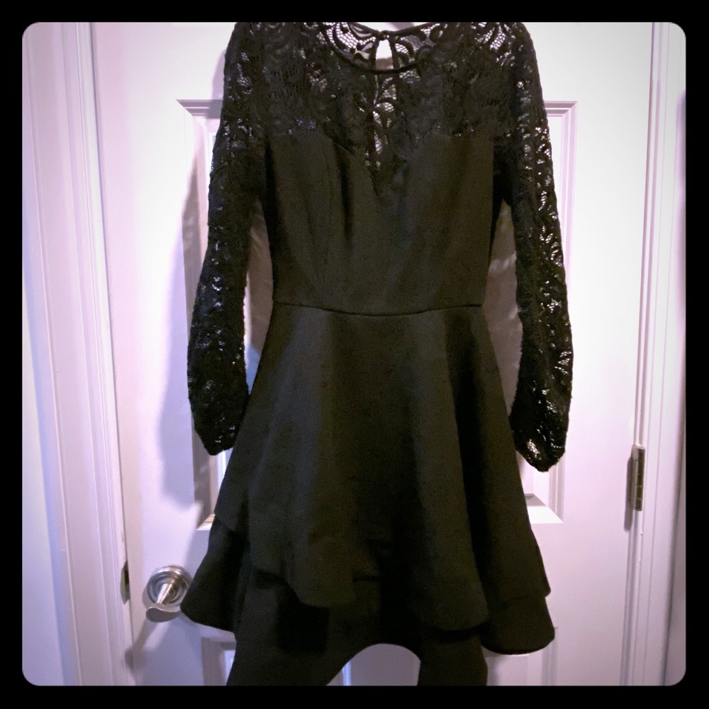 B. Darlin Black multi layer skirt with Lacey top.